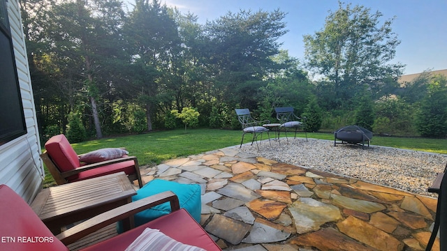 view of patio / terrace with an outdoor living space and a grill