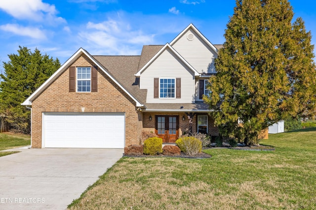 view of front of house with a garage and a front yard