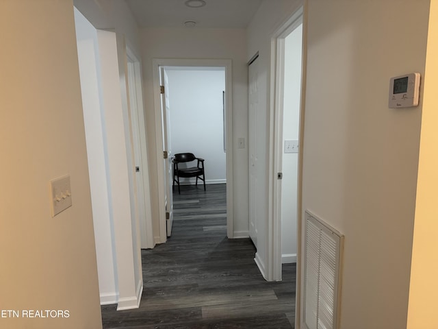 corridor featuring dark hardwood / wood-style flooring