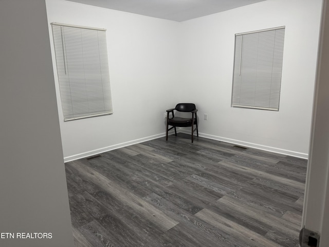 unfurnished room featuring dark hardwood / wood-style floors