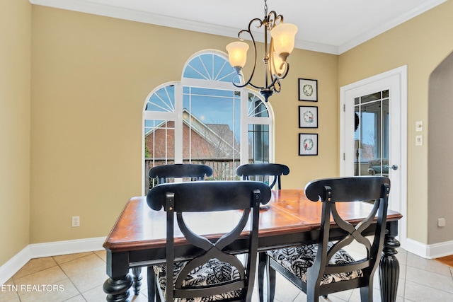 tiled dining area with a notable chandelier and crown molding