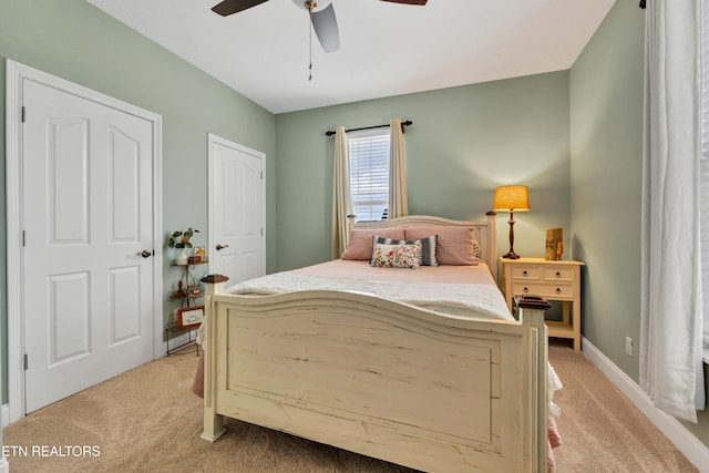 bedroom with light colored carpet and ceiling fan