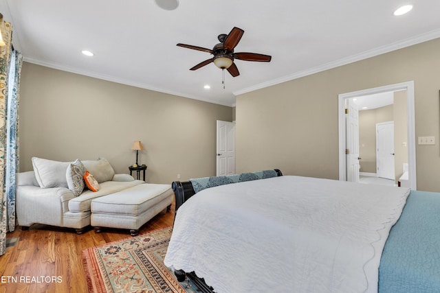 bedroom with ornamental molding, light hardwood / wood-style floors, and ceiling fan