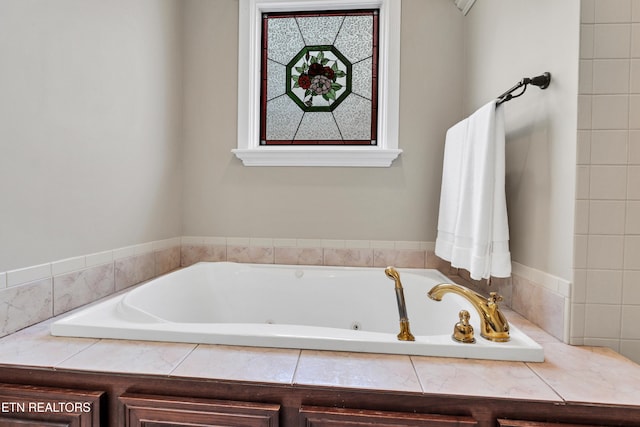 bathroom with tiled bath