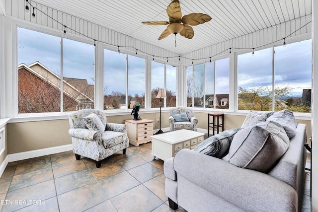 sunroom featuring ceiling fan