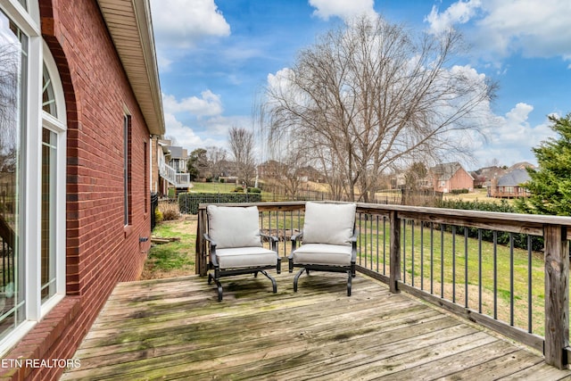 wooden deck with a yard