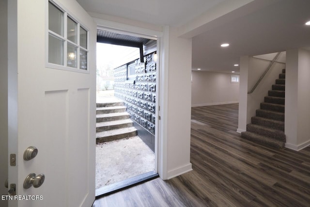 doorway to outside featuring dark hardwood / wood-style flooring