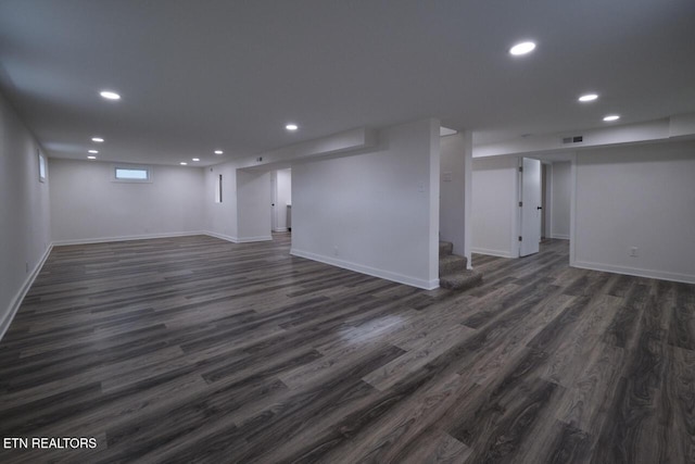 basement featuring dark hardwood / wood-style flooring