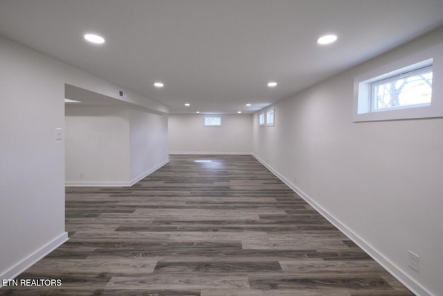 basement with dark wood-type flooring