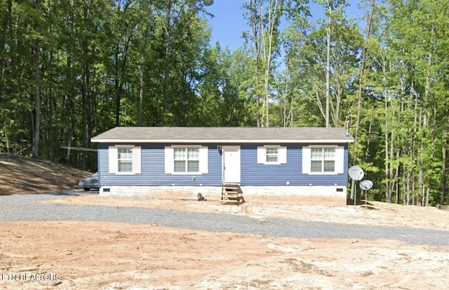 view of front of property featuring entry steps and crawl space