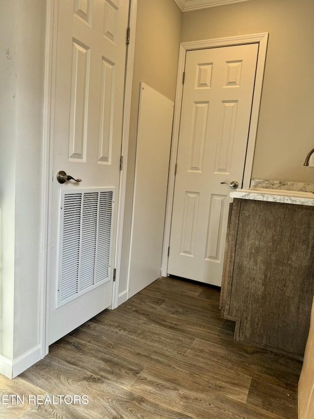 interior space with wood finished floors and visible vents