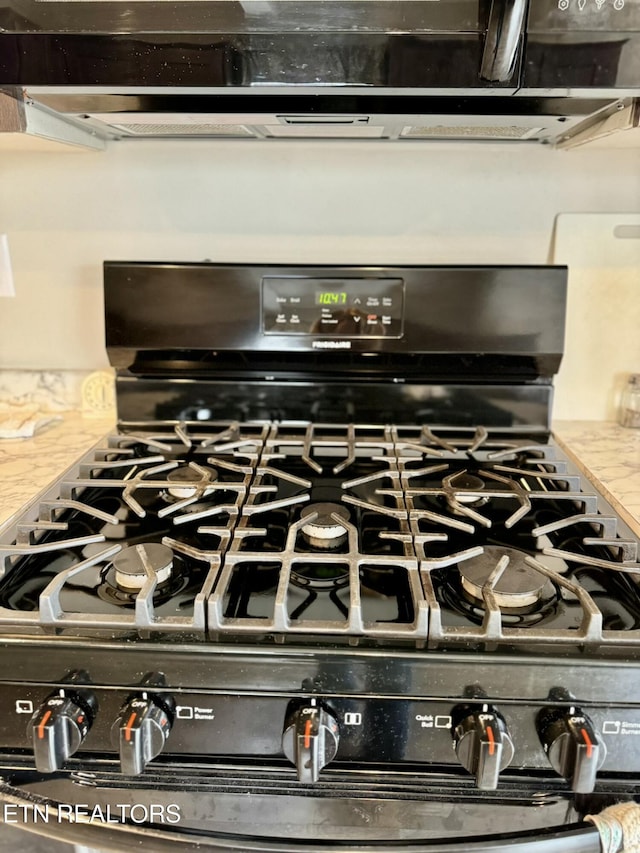 room details featuring black range with gas stovetop