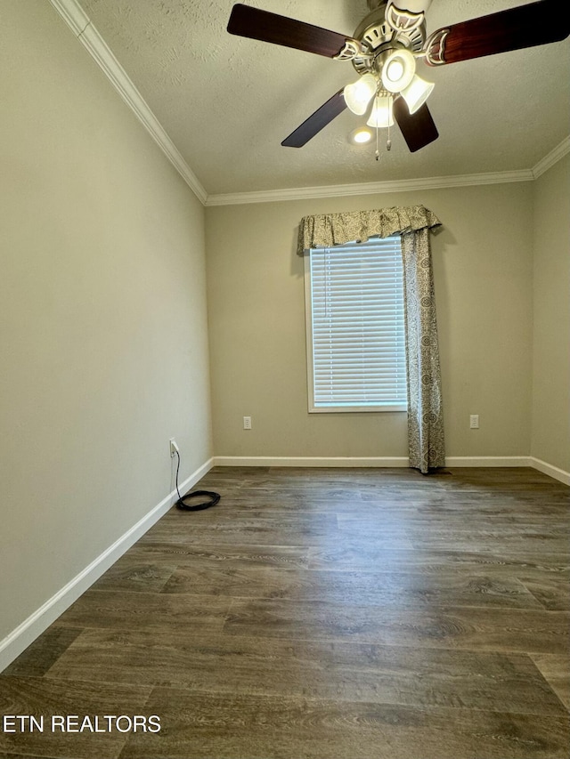 spare room featuring baseboards, a textured ceiling, ornamental molding, and dark wood-type flooring