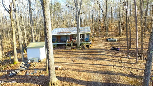 view of front facade with a wooden deck and ac unit