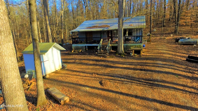 view of yard with a wooden deck and a shed