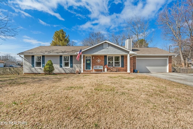 ranch-style home featuring a porch, a garage, and a front yard