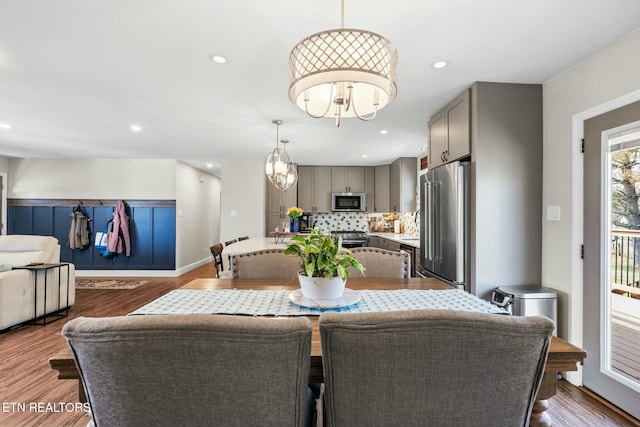 dining area featuring dark wood-type flooring