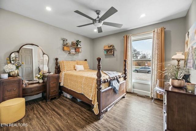 bedroom featuring ceiling fan and dark hardwood / wood-style flooring