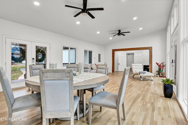 dining area featuring ceiling fan, lofted ceiling, light wood-type flooring, and french doors