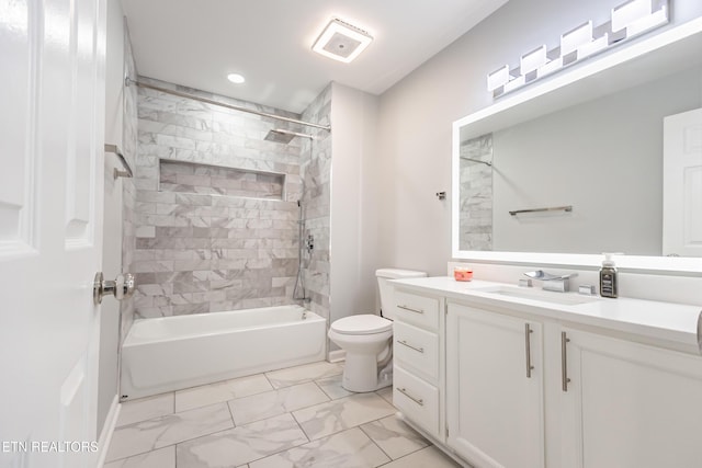 full bathroom with vanity, toilet, and tiled shower / bath combo