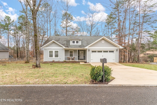 view of front facade with a porch, a garage, and a front yard