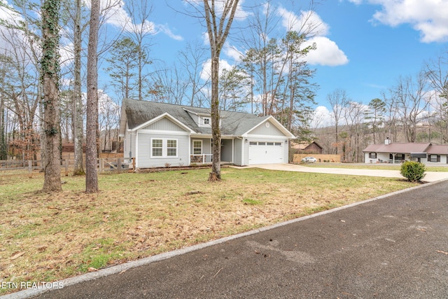 single story home with a garage and a front lawn