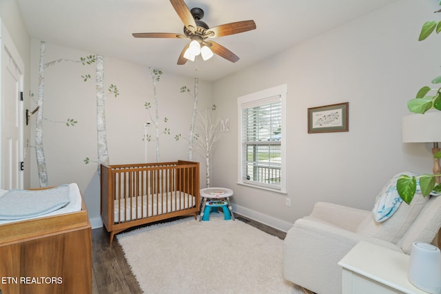 bedroom featuring ceiling fan and dark hardwood / wood-style flooring