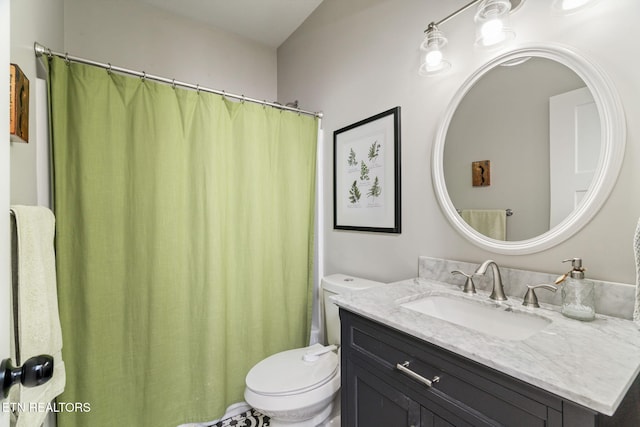 full bathroom featuring vanity, shower / bathtub combination with curtain, and toilet