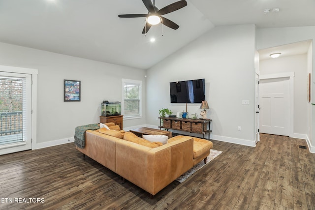 living room with dark hardwood / wood-style flooring, high vaulted ceiling, and ceiling fan