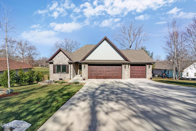 view of front of home featuring a garage and a front lawn