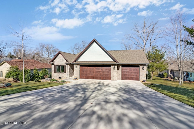 view of front of home featuring a garage and a front lawn