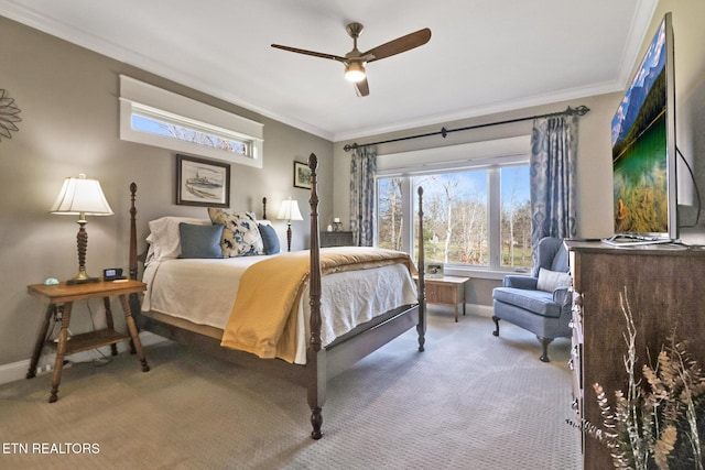 carpeted bedroom with ceiling fan and ornamental molding