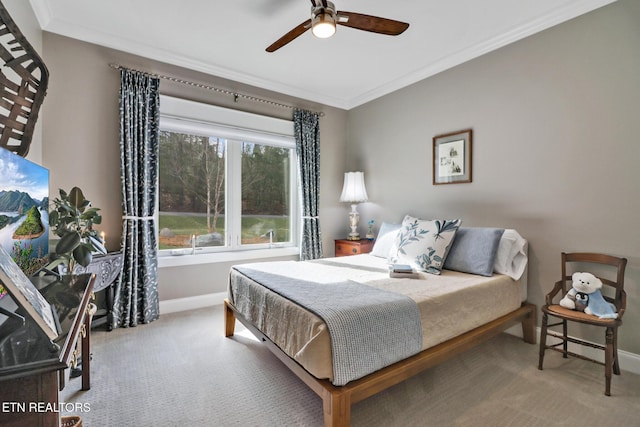 bedroom with crown molding, carpet floors, and ceiling fan