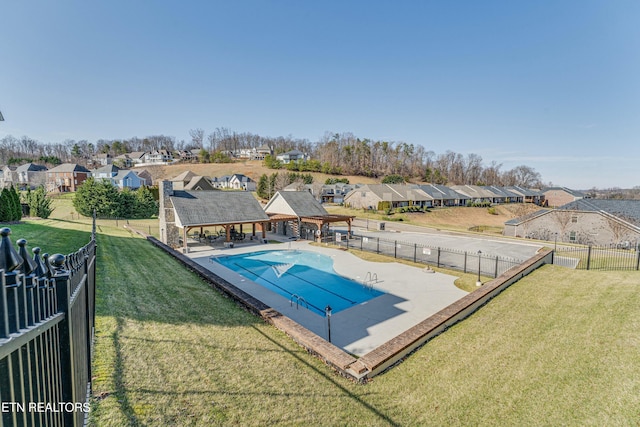 view of swimming pool featuring a residential view, a fenced backyard, and a fenced in pool