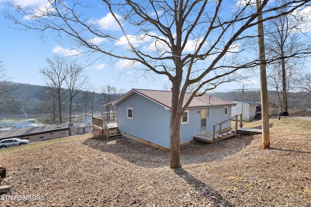 view of home's exterior with a deck