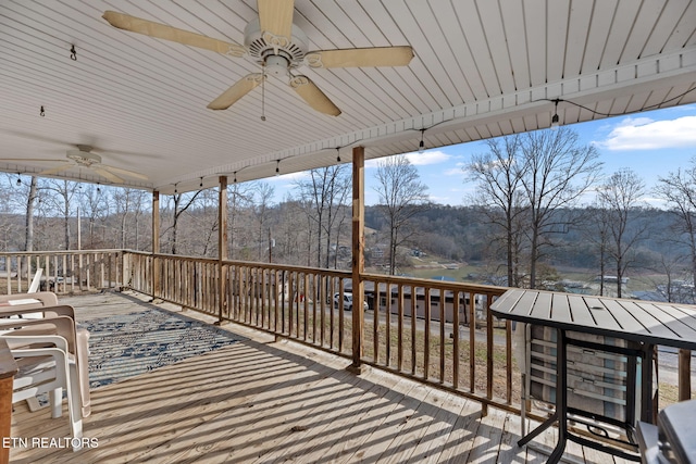 wooden terrace with ceiling fan