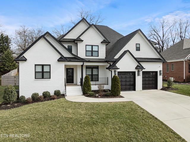 modern farmhouse style home with covered porch, brick siding, a shingled roof, driveway, and a front yard