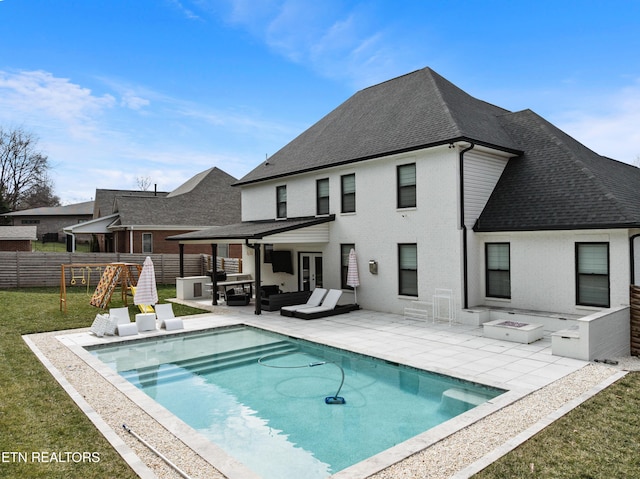 rear view of property featuring french doors, a yard, a shingled roof, a patio area, and fence