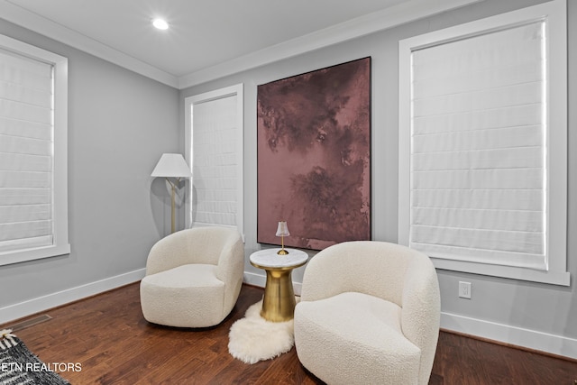 living area featuring ornamental molding, recessed lighting, baseboards, and wood finished floors