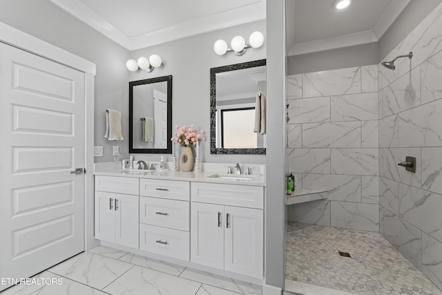 full bathroom featuring a sink, marble finish floor, ornamental molding, a tile shower, and double vanity