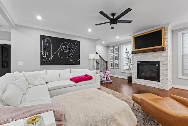 living area with recessed lighting, dark wood-type flooring, baseboards, stairs, and ornamental molding