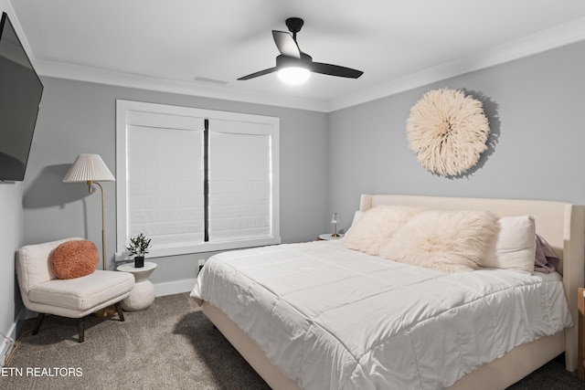 bedroom with visible vents, baseboards, a ceiling fan, ornamental molding, and carpet flooring