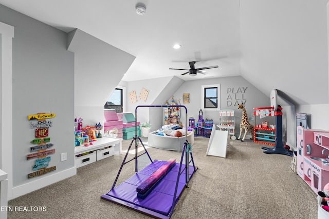 rec room featuring lofted ceiling, carpet floors, and a ceiling fan