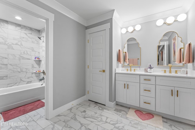 bathroom featuring marble finish floor, baseboards, and a sink