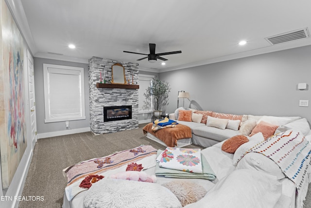 carpeted living room featuring recessed lighting, a fireplace, visible vents, baseboards, and crown molding