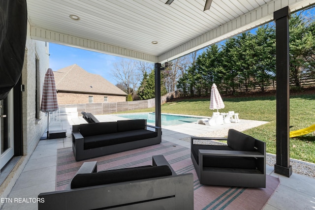 view of patio / terrace featuring ceiling fan, outdoor lounge area, a fenced backyard, and a fenced in pool