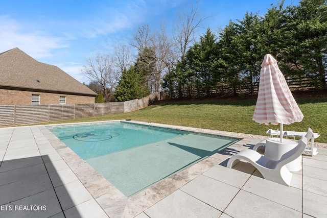 view of pool with a fenced in pool, a patio area, a fenced backyard, and a lawn