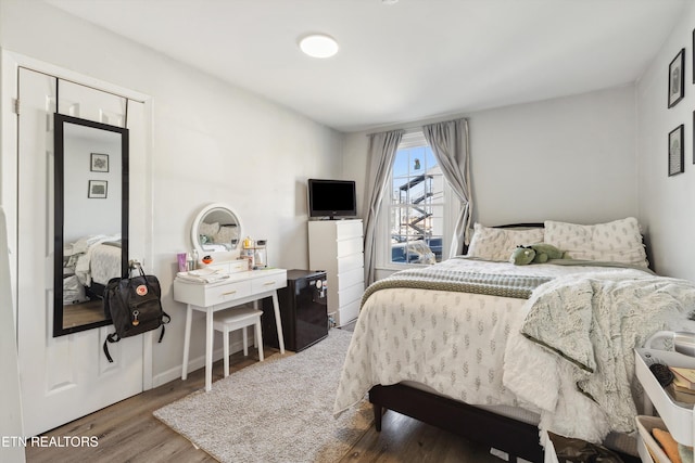 bedroom featuring wood finished floors