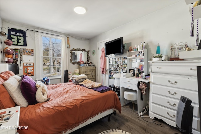 bedroom featuring dark wood-type flooring