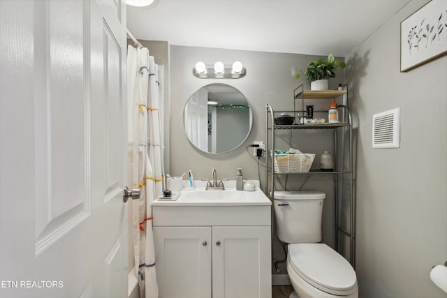 full bathroom with visible vents, vanity, and toilet